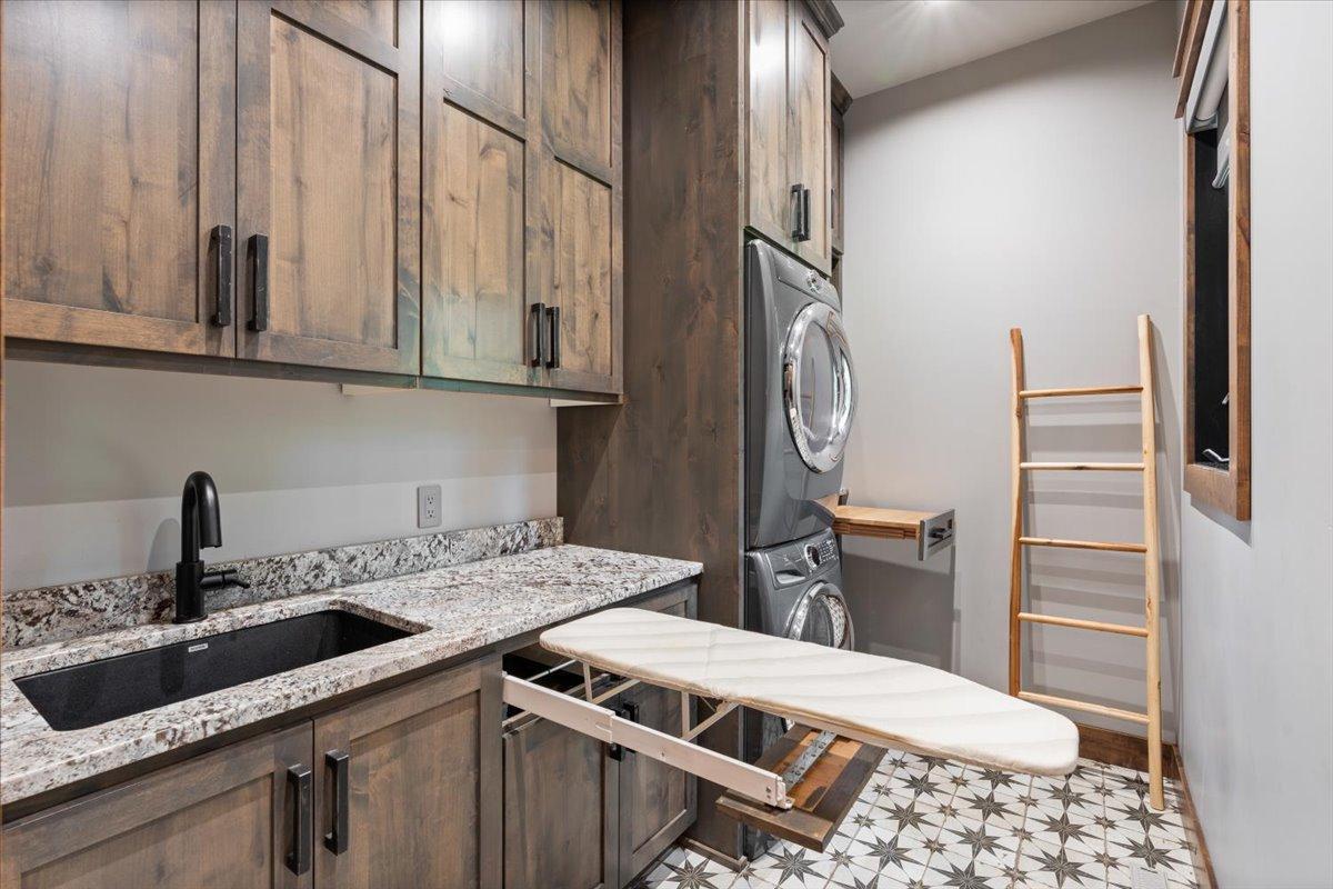 Hidden Ironing board and folding table near the dryer.