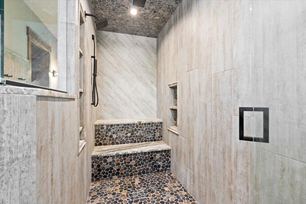 Master Bathroom Shower with 3 shower heads, and a steam shower with music and aroma therapy.