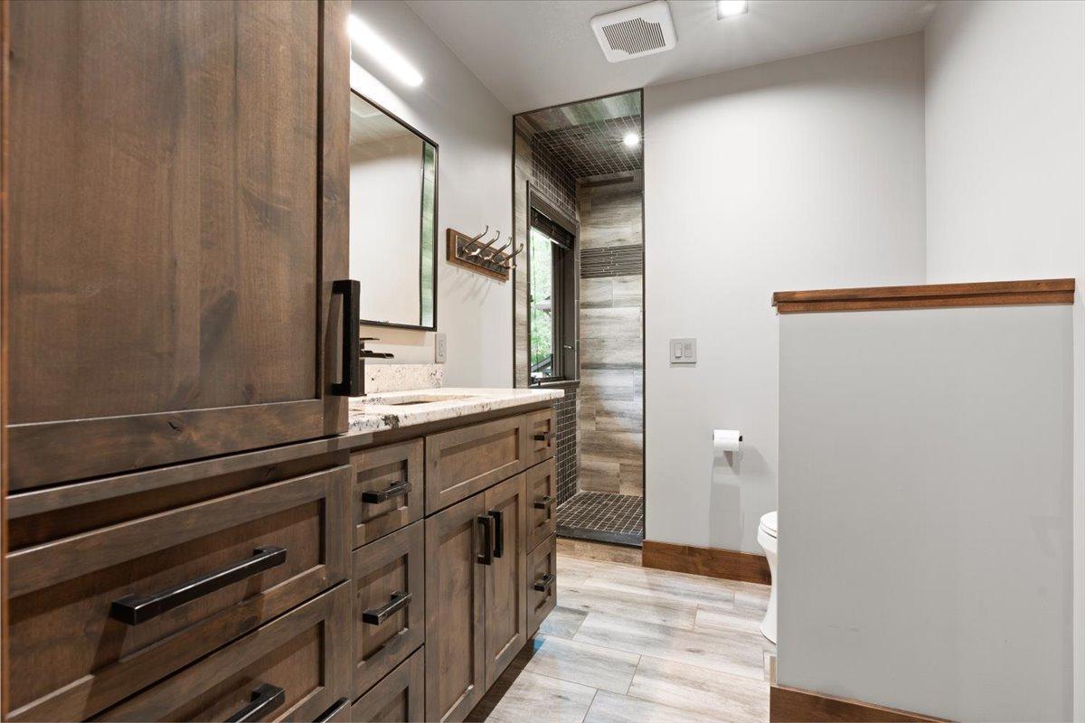Custom Cabinets and Granite Counter tops with a custom tile shower in the on-suite bedroom.