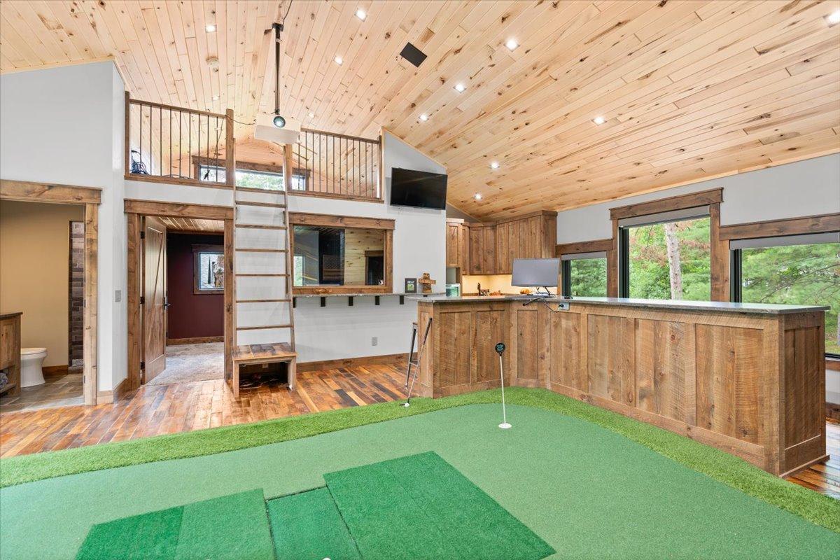 This space also has a wet bar with beverage fridge, ice maker, loft, 3/4 bathroom and office space that could also make a great bedroom.