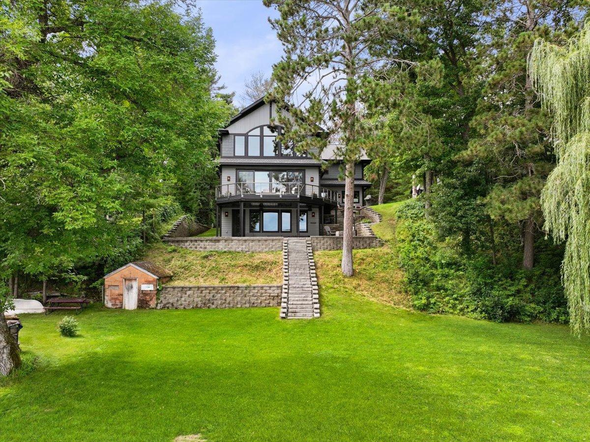 The flat landing area before the lake is perfect for recreation. It is also home to 2 boat houses for storage of all the lake toys. Slight elevation gives incredible views and easy access to the lake.