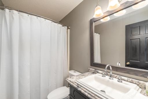 Upper Hall bath with new vanity and toilet.