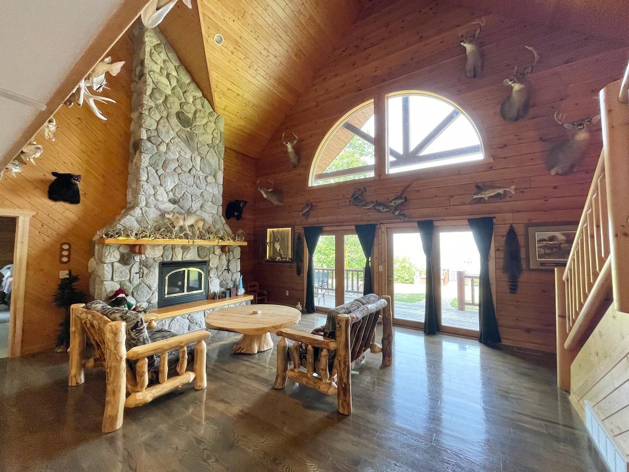 Huge Stone Fireplace and Large Windows