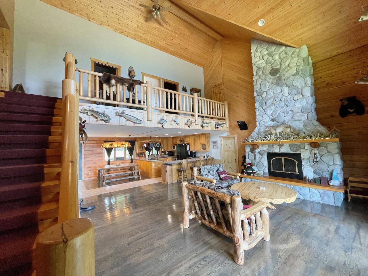 Loft Area Overlooks the Living Room with Lake Views