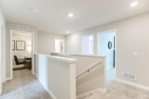 The upper level divides the primary bedroom and secondary for additional privacy and function. The flex room shown at the end of the hall can be used as an office, closet, toy, or hobby room.