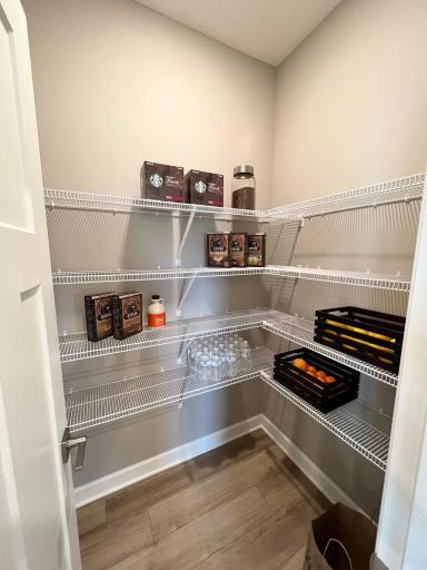 Walk in pantry. *Please note, photos are of a similar model home, features and colors in actual home will vary. Please contact listing agent for exact specifications.