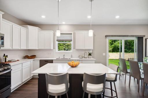 Lewis Standard Kitchen. Island will be white in actual home. *Please note, photos are of a similar model home, features and colors in actual home will vary. Please contact listing agent for exact specifications.