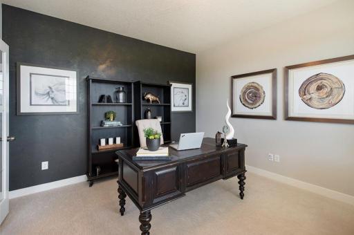 Main floor study with french doors. *Please note, photos are of a model, features in actual home will vary. Please contact listing agent for exact specifications.