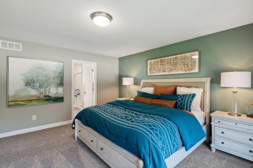 Lewis primary suite. *Please note, photos are of a similar model home, features and colors in actual home will vary. Please contact listing agent for exact specifications.