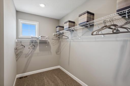 Lewis primary walk in closet. *Please note, photos are of a similar model home, features and colors in actual home will vary. Please contact listing agent for exact specifications.