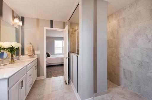 Serenity Shower bathroom. *Please note, photos are of a similar model home, features and colors in actual home will vary. Please contact listing agent for exact specifications.