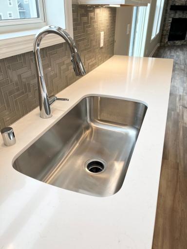 Single bowl undermount sink. Faucet and backsplash will be different, see another photo. *Please note, photos are of a similar model home, features and colors in actual home will vary. Please contact listing agent for exact specifications.