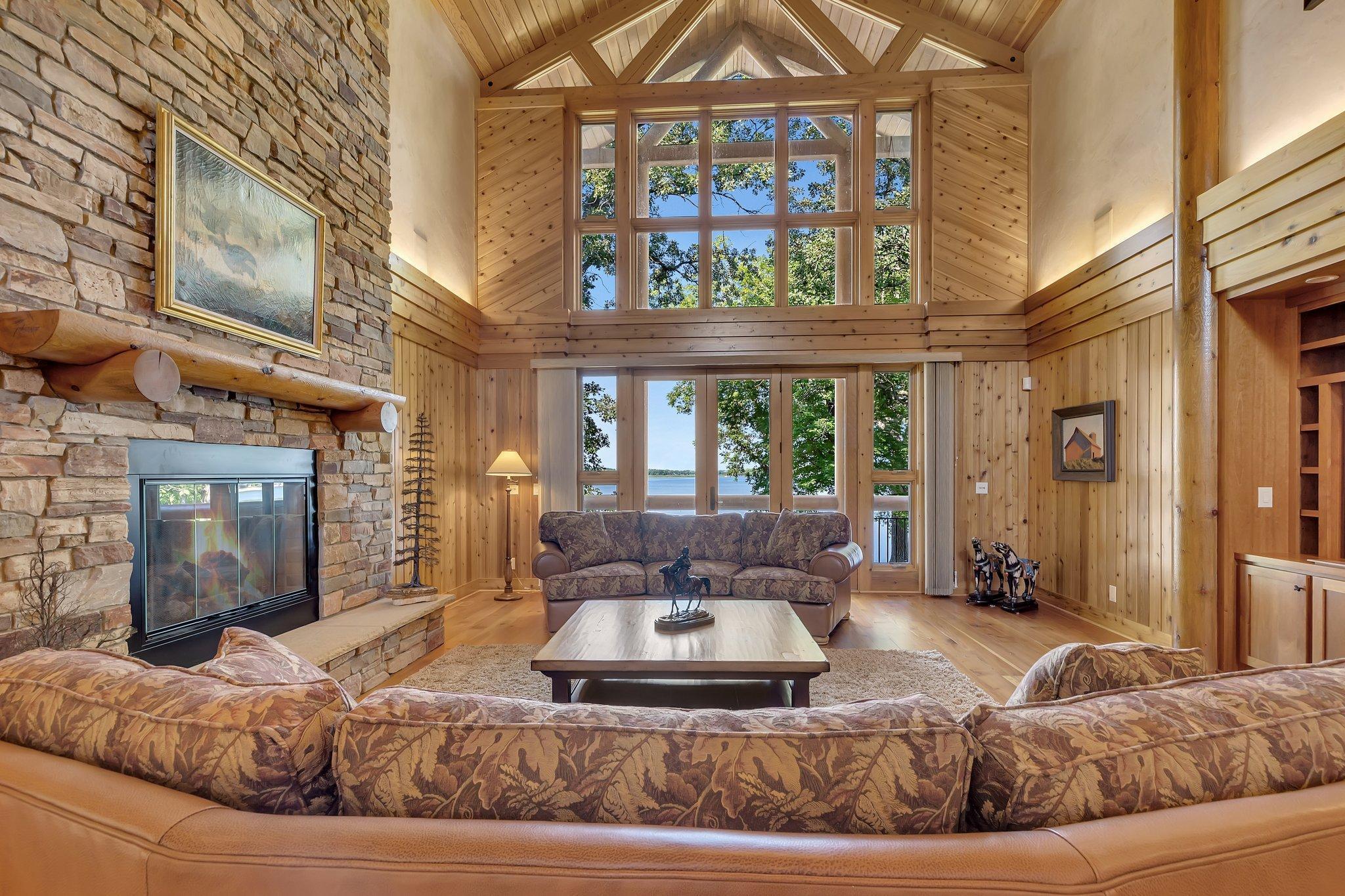 Massive windows/door frame the picturesque lake views allowing you to enjoy the amazing scenery.