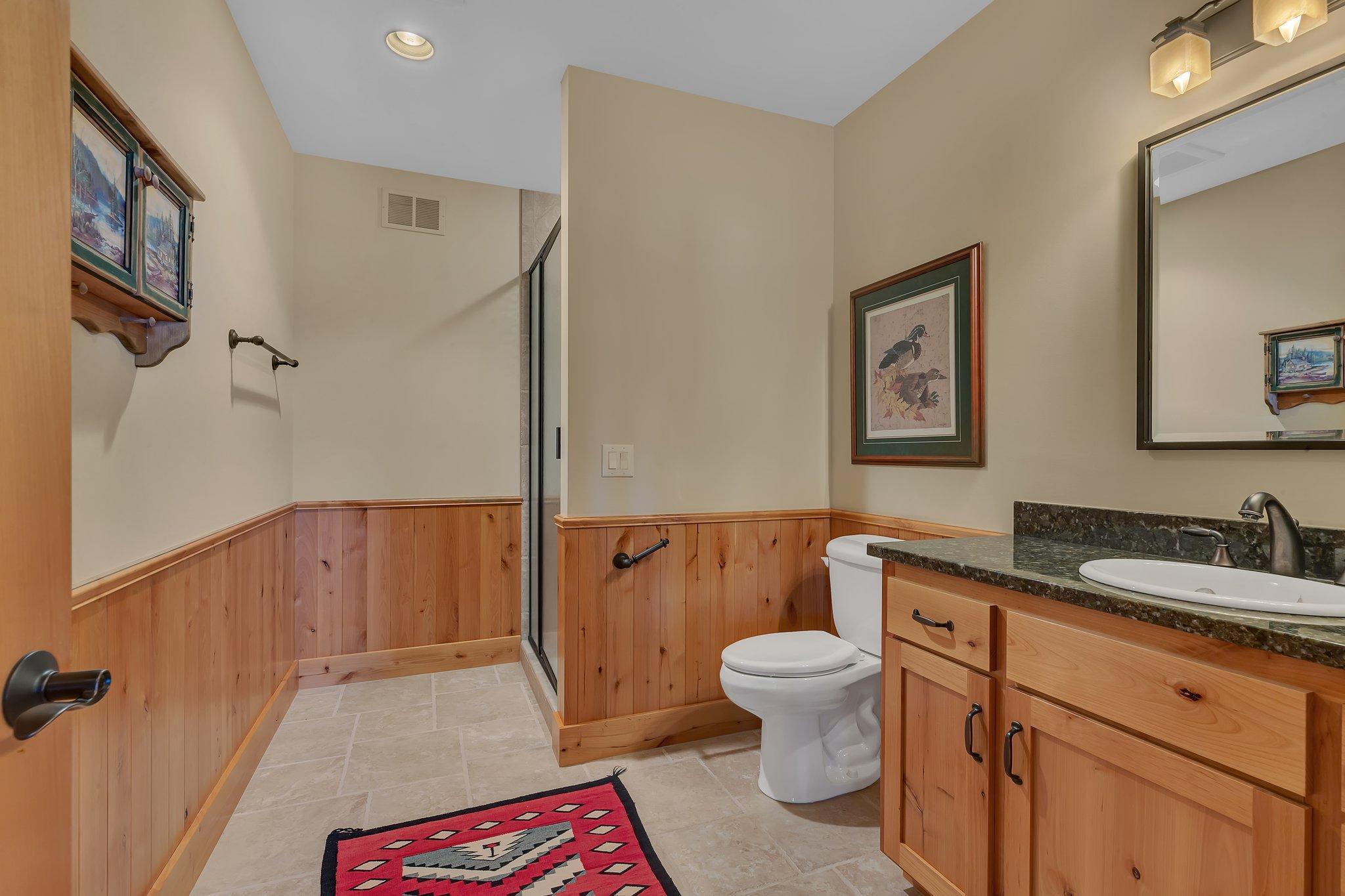Private bathroom in 1st lower level bedroom.