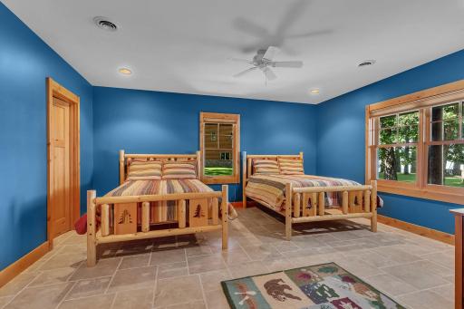 Additional bedrooms offer comfort and privacy for guests, each with a bathroom en suite. 1st of 3 lower level bedrooms.