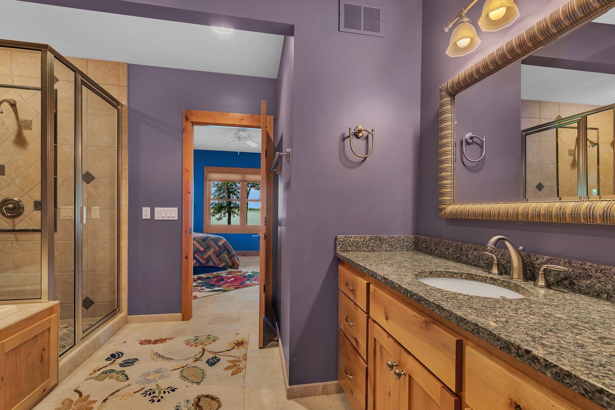 Connecting full bathroom between 2nd and 3rd lower level bedrooms. Complete with shower and jetted tub to enjoy after a day of fun on the lake!