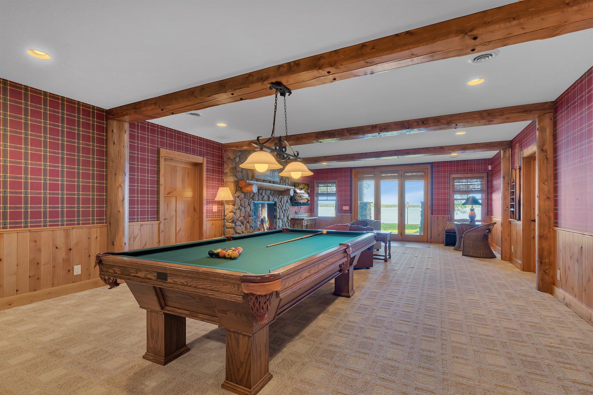 For those seeking entertainment, this pool table area stands ready to provide hours of enjoyment while taking in the amazing lake views.