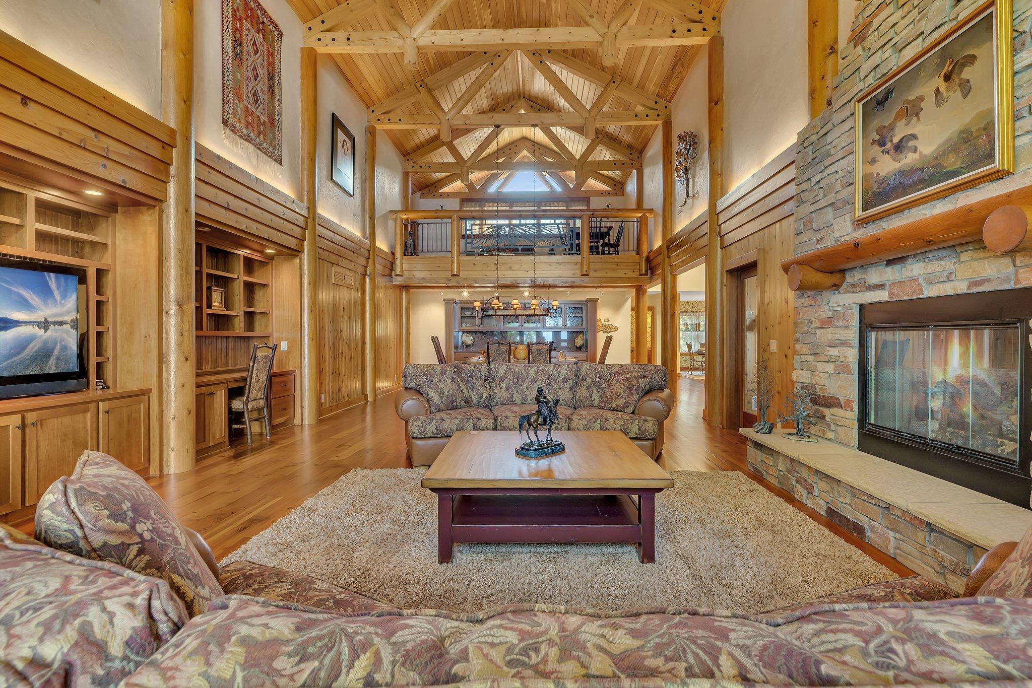The interior design is a true masterpiece of architecture with wood beams, hardwood floors, and soaring vault.