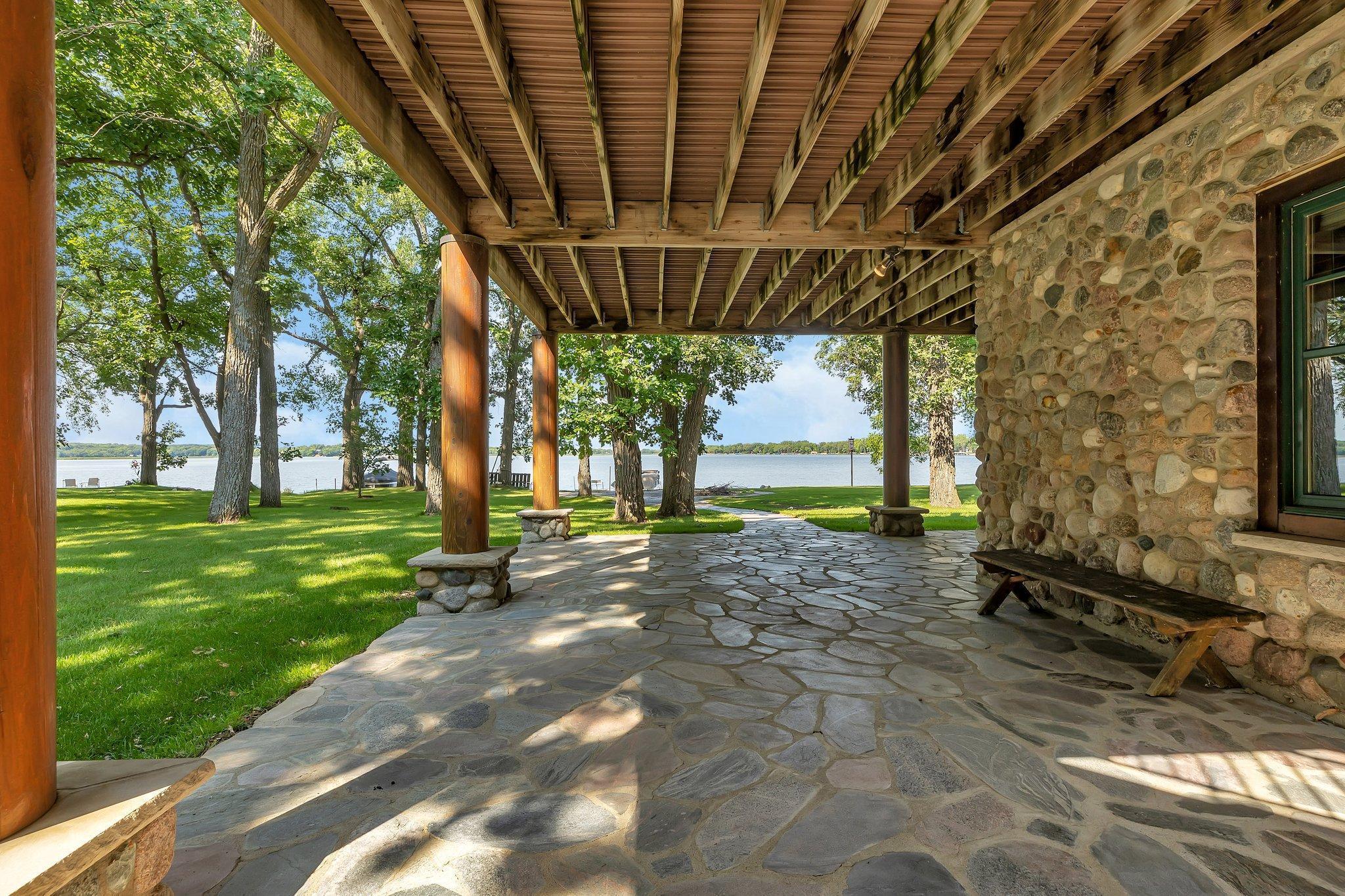 The basement seamlessly extends to a private outdoor patio, where you'll find yourself mere steps away from the calming waters of the lake.