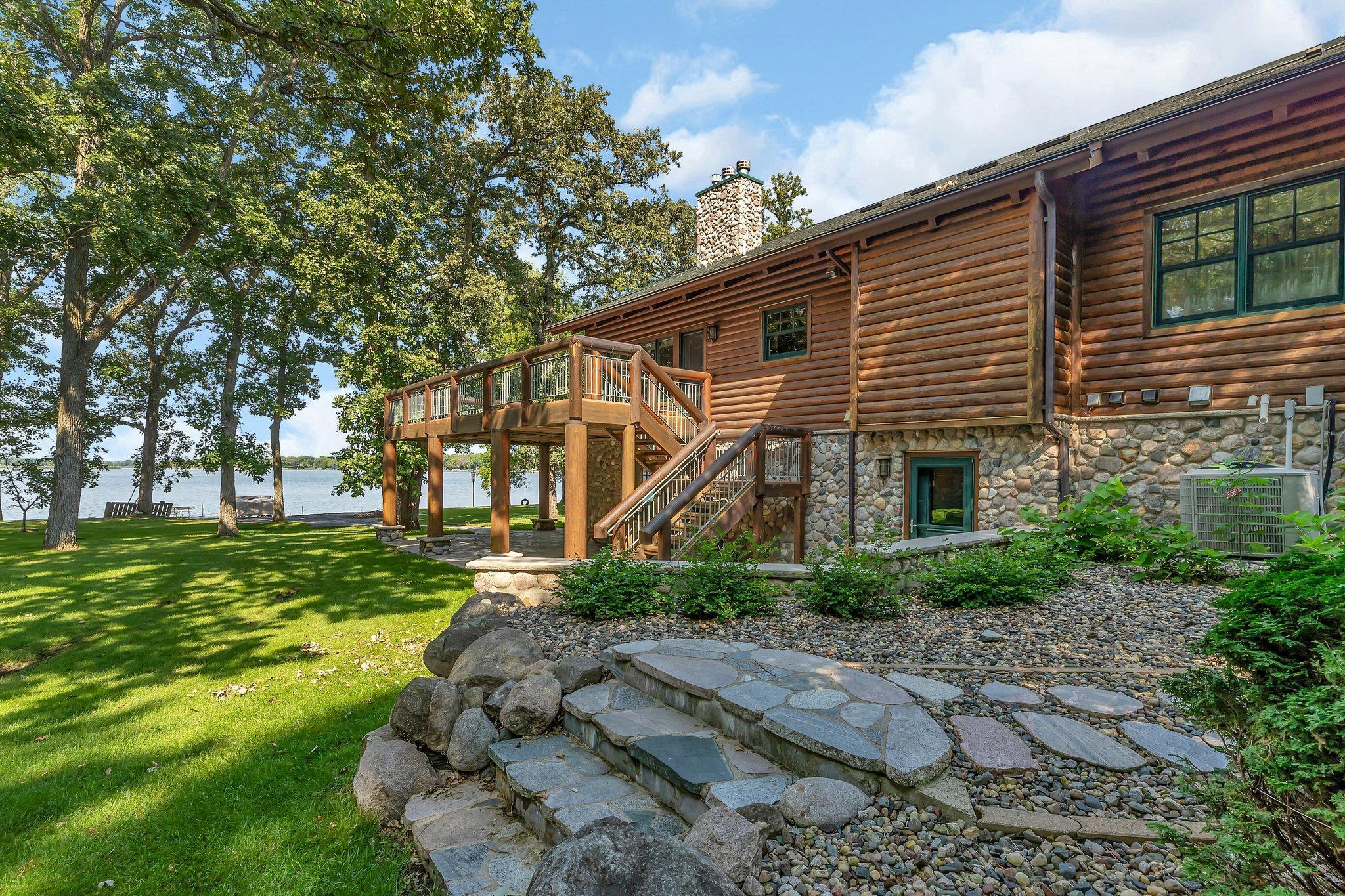 Outside, a spacious deck offers an extension of the home's living space. It's the ideal spot to savor your morning coffee, relax as the sun sets over the tranquil waters, or to stargaze as the night sky twinkles above.