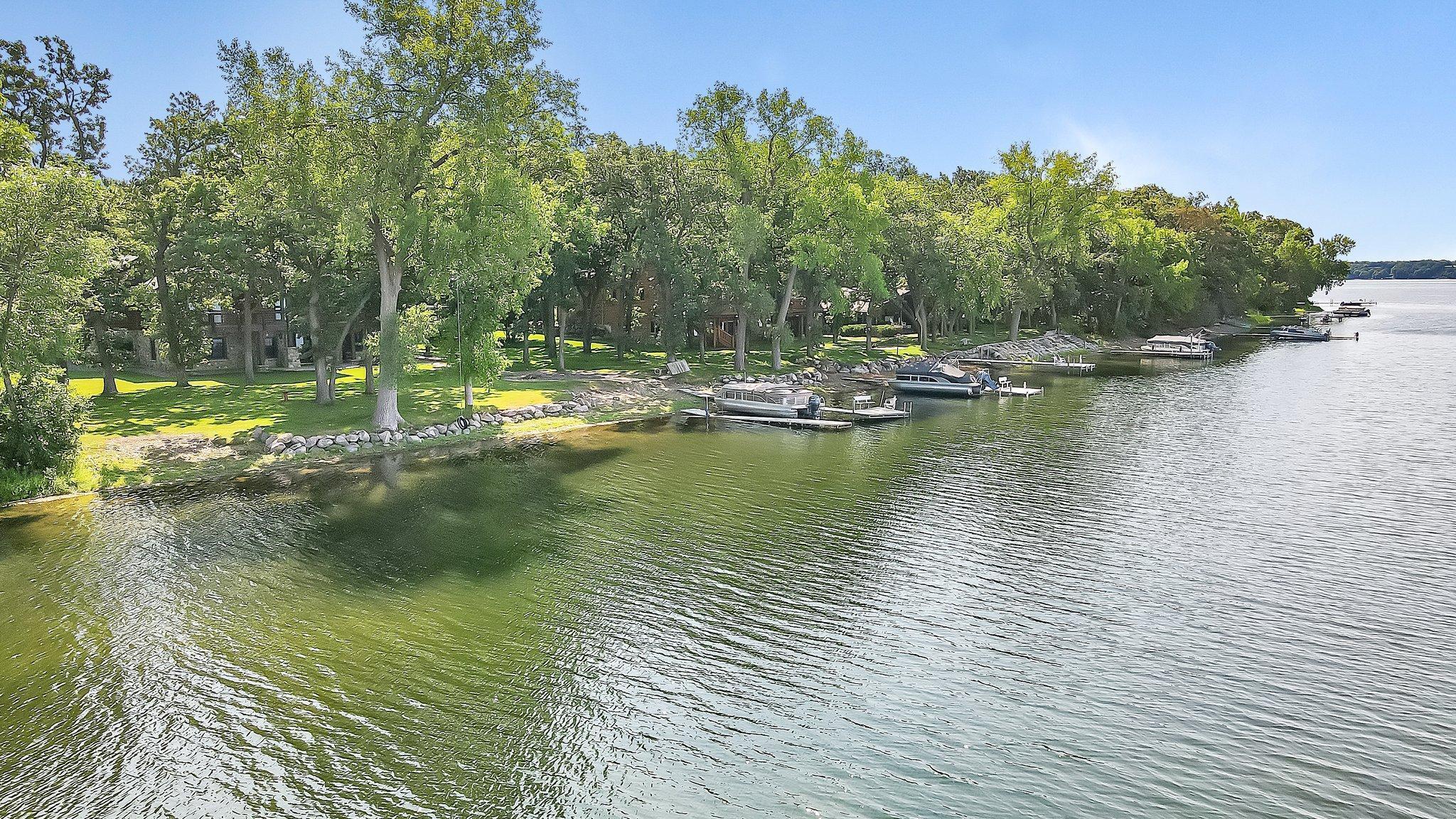 This stunning home offers the epitome of lakeside living. With 170 feet of pristine sandy beachfront and perfect elevation, you'll experience the true essence of waterfront luxury.