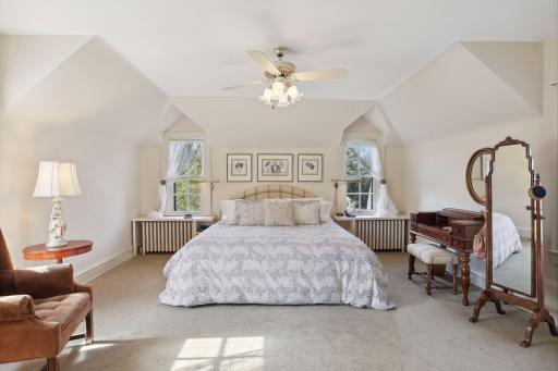 Spacious primary suite with seasonal views of Lake Harriet.