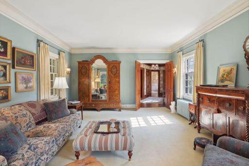 French doors lead to the formal living room from the entry hall.