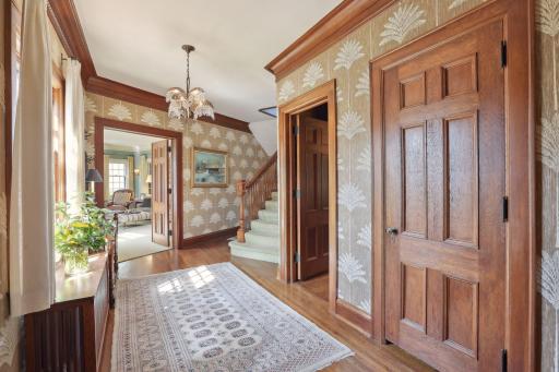 The large and gracious entryway features beautiful woodwork and designer wall treatments.