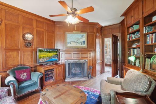 Main level family room or study with wood burning fireplace located just off the main entry hall. A service button on the wall still works!