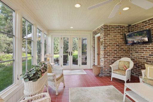 Wonderful accessibility to the backyard and gardens from the porch. An outdoor patio is just outside the porch.