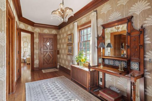 Heavy crown moulding and beautifully crafted solid wood doors throughout.