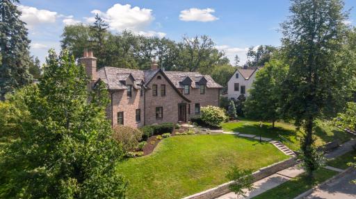 Beautifully constructed in 1929 as a custom home and lovingly maintained for the past 47 years with expertly crafted finishes throughout. This English Tudor sits upon an elevated double lot with a private level back yard surrounded by garden beds.