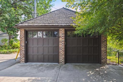 2-car garage will tall doors and a drop down staircase to upper storage.
