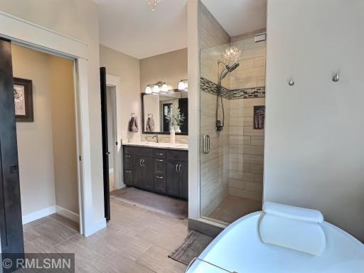 Imagine your own private retreat, the primary suite offers a private full bathroom including a shower surrounded with tile.