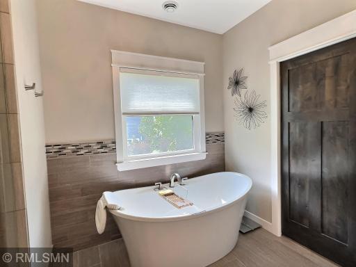 The primary bathroom also has this wonderful modern soaking tub, could you really want anymore with this private bathroom?