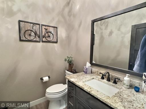 The half bathroom on the main level is spacious and ideal for visiting guests and just steps away from the gathering areas.