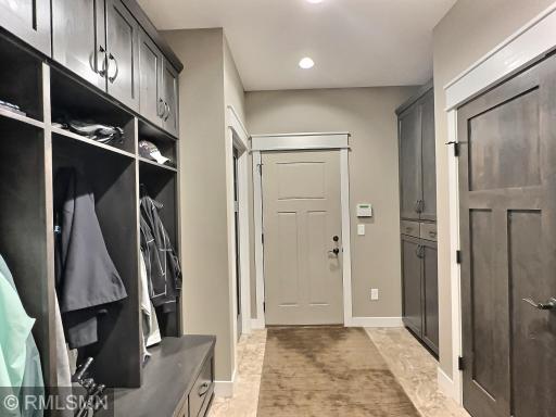 Stay organized with the mud room offering built-in lockers, large closet and under stair storage area. Door leads to garage.