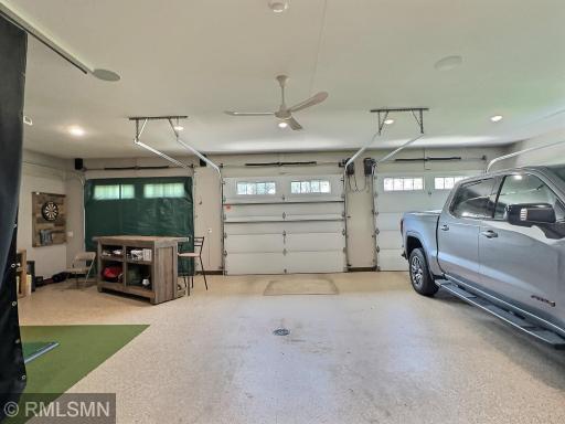A lake home with a triple garage is hard to find. Now one that is heated and has hot & cold water with a floor drain, almost impossible!