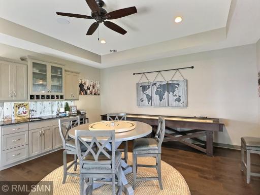 Now this is a family room the kids and adults can enjoy, complete with a full wet bar, wood floor and stunning trey ceiling.