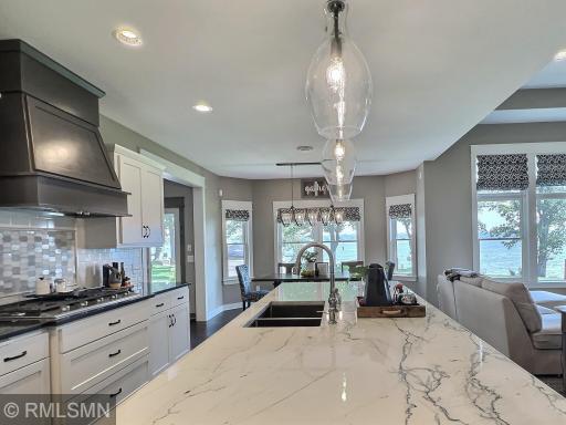 Beautiful granite counter, subway tile, decorative backsplash behind stove and wood floor are just a few items to fall in love with.