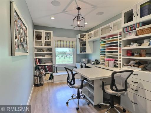Craft, sewing, or hobby room. Make this room whatever you like, the lighting is great and the storage options are endless!
