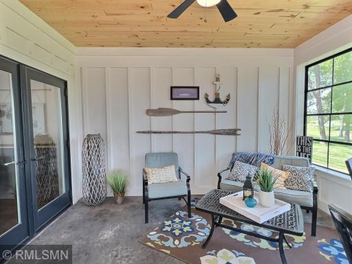 The three-season porch is just off the family room and has great custom accents including stamped concrete flooring.