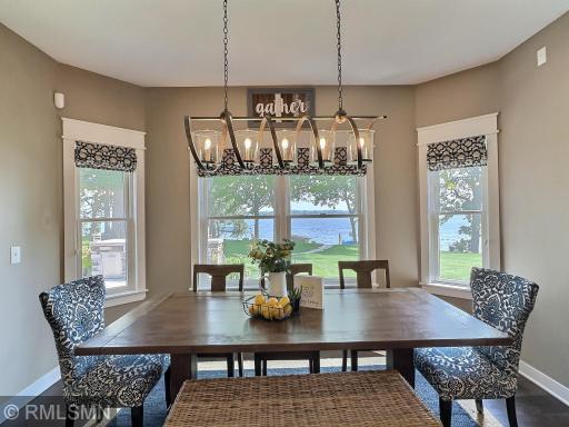 Spend meal time around the dining table offering a unique light fixture, wood flooring and another spot to take-in the lake views.