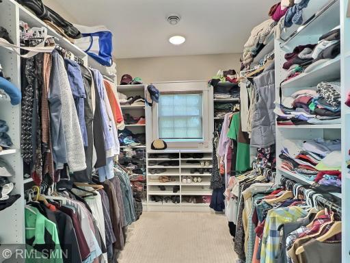 There is more than enough room in the private primary suite walk-in closet, you can continue shopping...we promise!