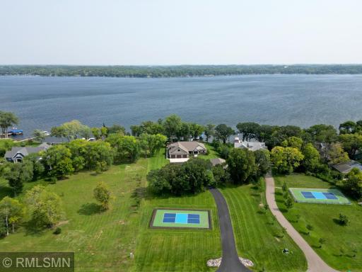 All situated on 1.64 lush green acres complete with a detached garage and pickle ball court. Are you ready to call Sugar Lake home?