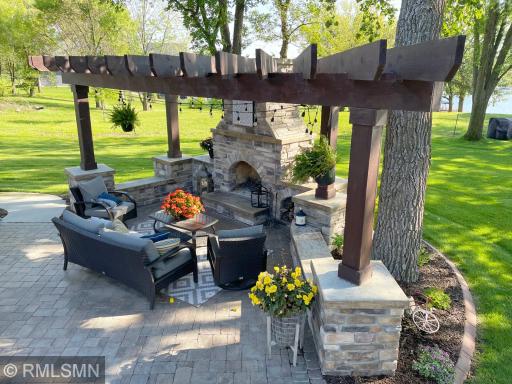 Spend your days, anytime of the year, enjoying a fire with views of Sugar Lake situated under tower trees creating privacy.