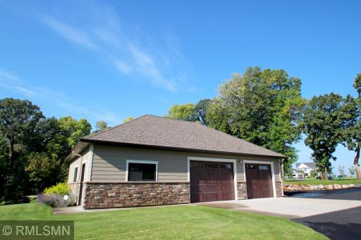 The double detached heated garage offers all the overflow space you need for your toys and includes an half bathroom.
