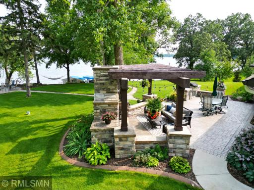 Imagine your summer days spent out on the lakeside patio with a built-in fireplace & grill and large paver patio.