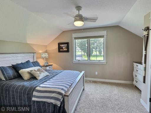 The second bedroom in the upper level also has great views, a ceiling fan, carpet and a closet with double doors.