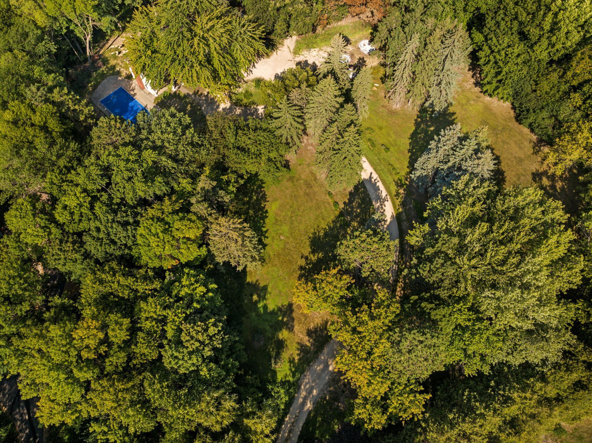 Enjoy the private long winding driveway from Tonkawa Rd.